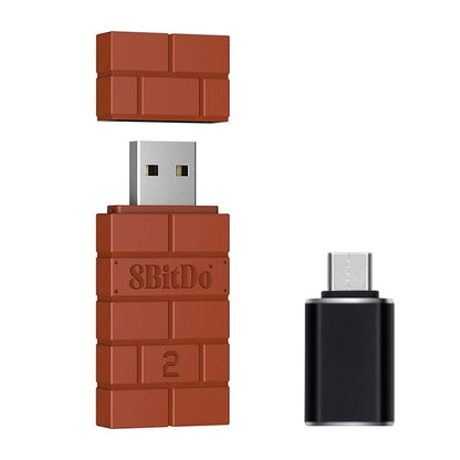 8Bitdo USB Wireless Bluetooth Adapter 2 with removable brick-style cap and USB-C converter – multi-platform controller adapter.