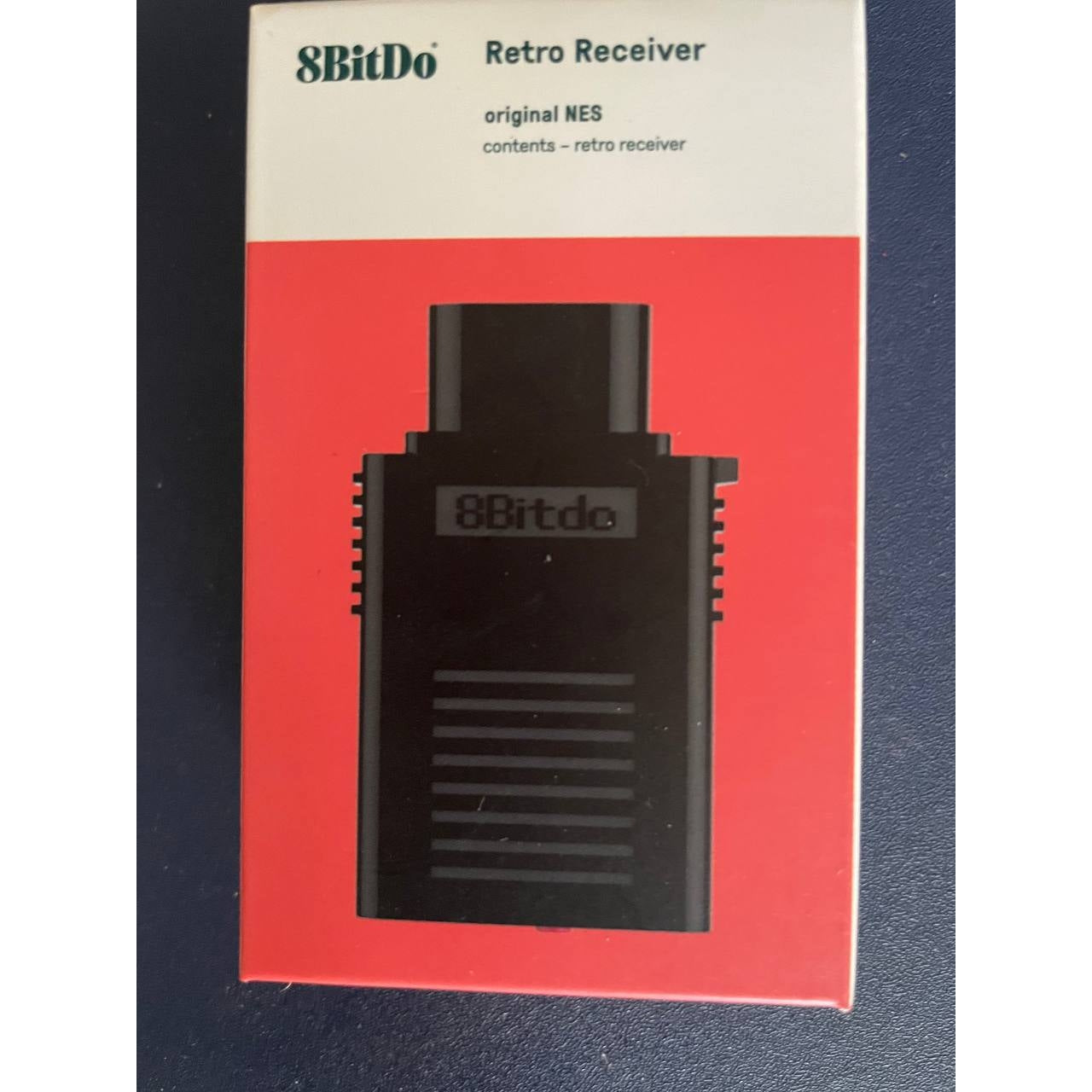 8Bitdo Retro Receiver NES Version retail box – front packaging showing the wireless Bluetooth adapter for original NES.